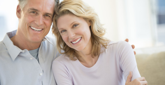 Couple Smiling Together At Home