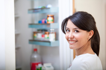 Woman looking inside the fridge