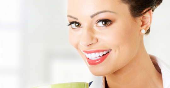 Smiling businesswoman having coffee break Smiling Businesswoman